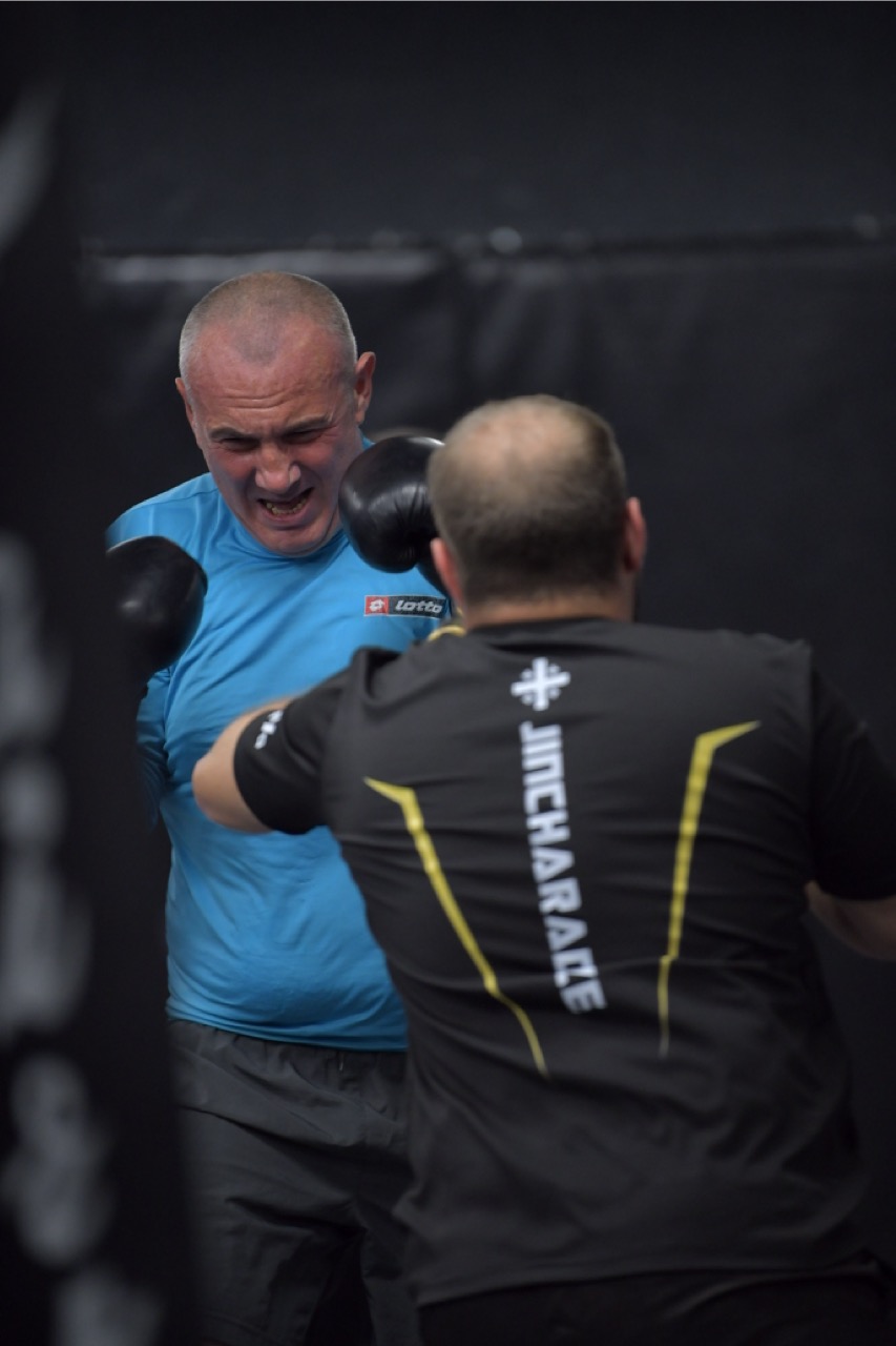 Mixed martial arts sparring inside the gym