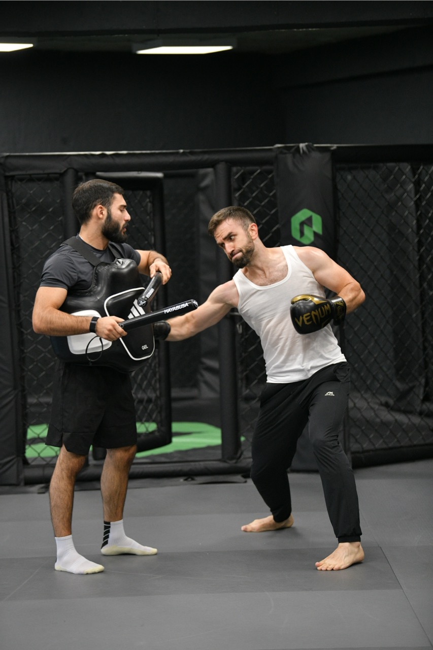 Focus mitts and striking gear used during MMA camp training